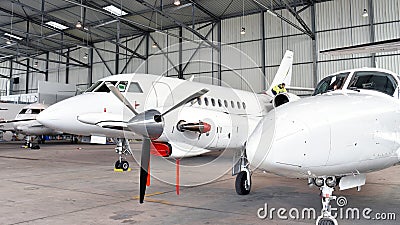 Aircraft in hangar at the airport - architecture and buildings i Stock Photo