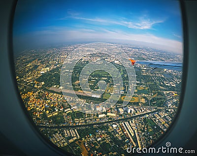 Aircraft illuminator window view, Bangkok Stock Photo