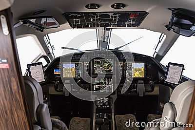 Aircraft interior, view into the cockpit of a modern turboprop aircraft with glass cockpit avionics Stock Photo