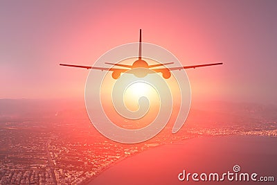 The aircraft is landing in a seaside resort town Stock Photo