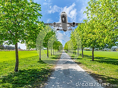 Aircraft noise over the park residential area Stock Photo