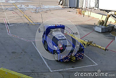 American Airlines Aircraft Tug Truck and Chocks Editorial Stock Photo