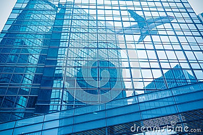 Aircraft reflected in the building curtain wall Stock Photo