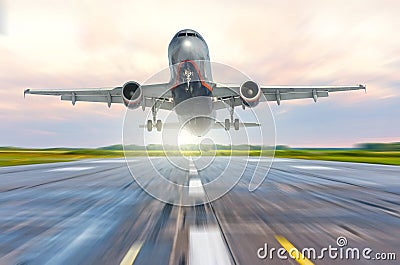 Aircraft speed on the landing runway at dawn Stock Photo