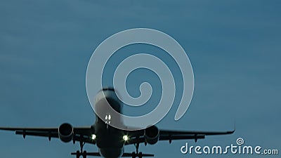 Aircraft in sunset. Plane passes overhead in dusk Aircraft in sunset. Plane passes overhead in dusk
