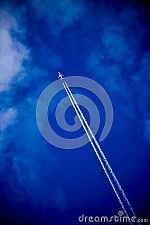 Aircraft and vapour trail Stock Photo