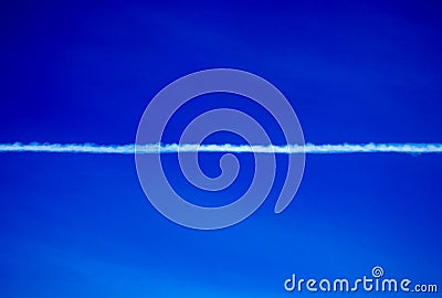 Aircraft Vapour Trail Across a Clear Blue Sky Stock Photo