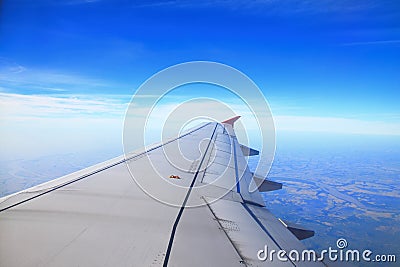 Aircraft wing, cloud and clear sky Stock Photo