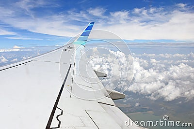 Airplane wing with the clouds Editorial Stock Photo