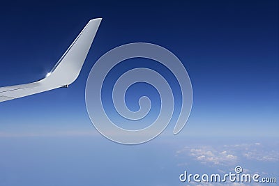 Aircraft wing detail flying high up Stock Photo