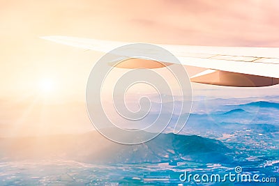 Aircraft wing with mountains on the background Stock Photo