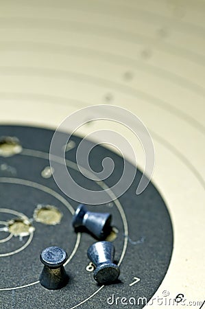 Airgun ammunition with target paper Stock Photo