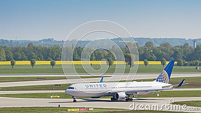 Airliner Boeing 767 of United Airlines taxiing in Munich airport Editorial Stock Photo