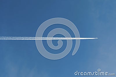 Airliner high in blue clear sky Stock Photo