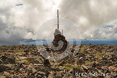 Ð¡airn made up of each other on top of a mountain in Altai to in Stock Photo