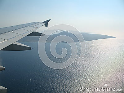 Airplan wing over the sea Stock Photo