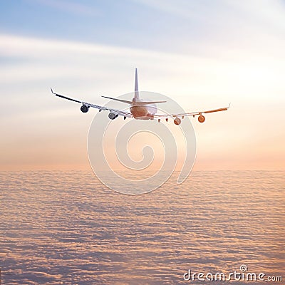 Airplane above the clouds Stock Photo