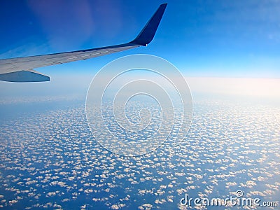 Airplane above clouds Stock Photo