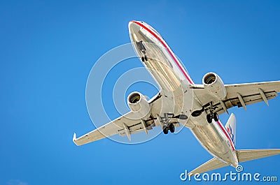 Airplane approaching the airport and landing in Miami Editorial Stock Photo