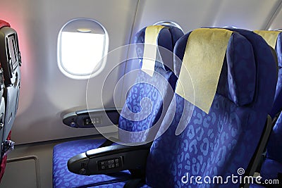 Airplane blue seat and window Stock Photo