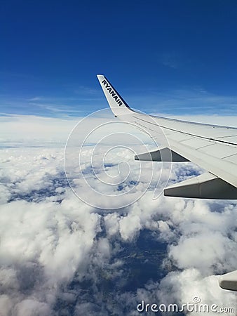 Airplane blue sky and clouds Editorial Stock Photo