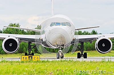 Airplane blue sky clouds flight airport grass green taxi Stock Photo