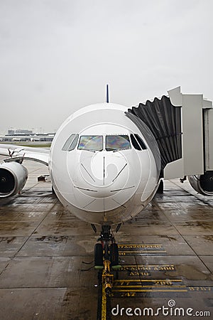 Airplane boarding in the rain Editorial Stock Photo