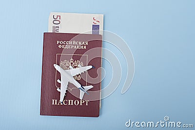 Airplane on the cover of a Russian passport. Euro. Travel concept. Blue background Stock Photo