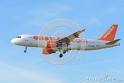 Airplane easyJet G-EZWB Airbus A320-200 is landing at Schiphol airport. Editorial Stock Photo