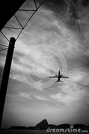 Airplane in flight over the city of Rio de Janeiro Stock Photo