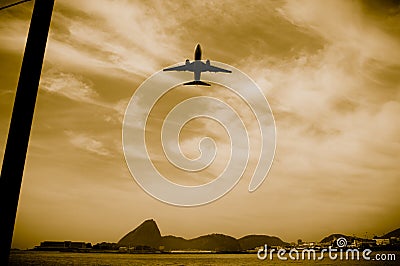 Airplane in flight over the city of Rio de Janeiro Stock Photo