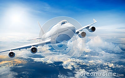 Airplane flying above clouds Stock Photo