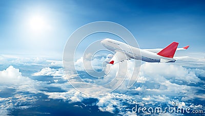 Airplane flying above clouds Stock Photo