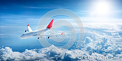 Airplane flying above clouds Stock Photo