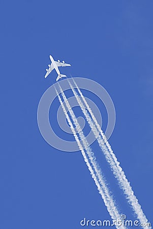 Airplane flying in blue sky Stock Photo