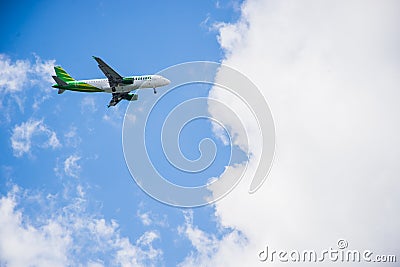 Airplane flying blue sky Editorial Stock Photo