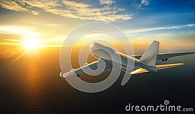 Airplane flying over the sea during sunset Stock Photo