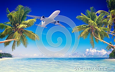 Airplane Flying Over Tropical Beach Travel Concept Stock Photo