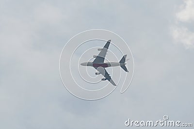 Airplane flying on sky in sunshine day Stock Photo