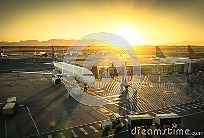 Airplane at international airport terminal gate Stock Photo