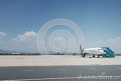 Airplane landed on airfield Stock Photo