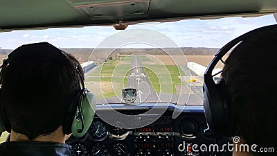 Airplane student and flight instructor landing on runway Stock Photo