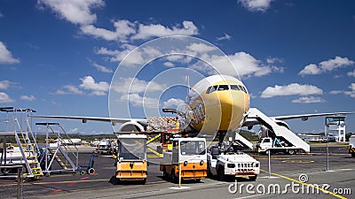 Airplane loading cargo. Editorial Stock Photo