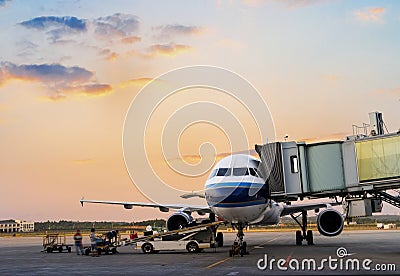 Airplane near the terminal in an airport Stock Photo