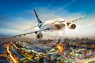 Airplane over city Stock Photo