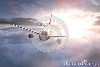 Airplane over the clouds Stock Photo