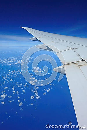 Airplane over clouds Stock Photo