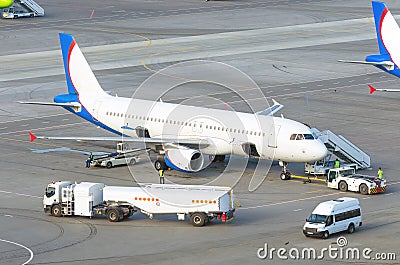 Airplane parking airport during service before the flight Editorial Stock Photo