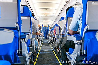 Airplane with passengers on seats Editorial Stock Photo