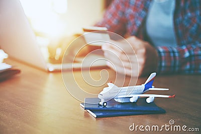 Airplane with passports near paying with credit card Stock Photo